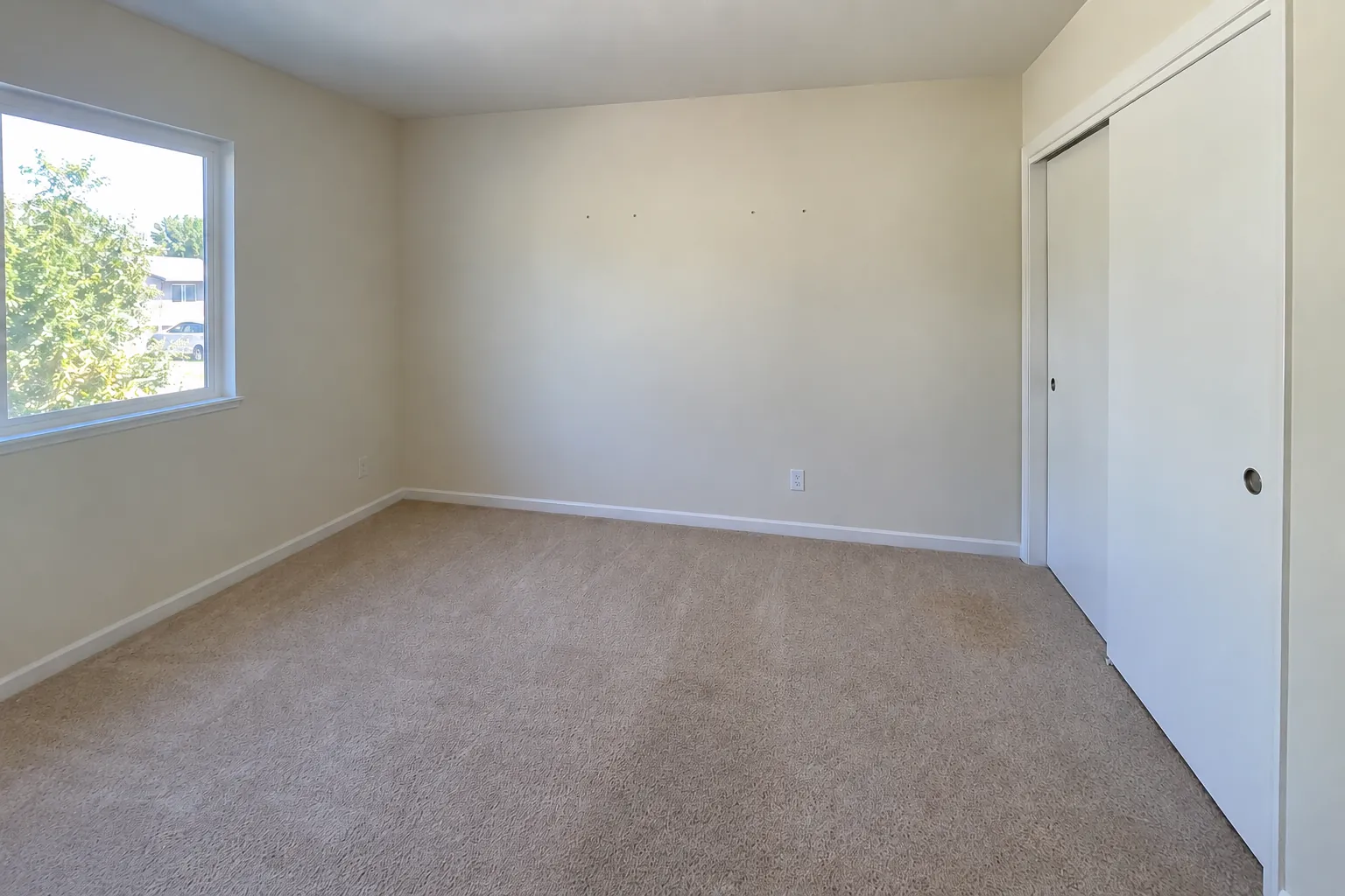 Bedroom at move-out: four small nail holes in the same wall.