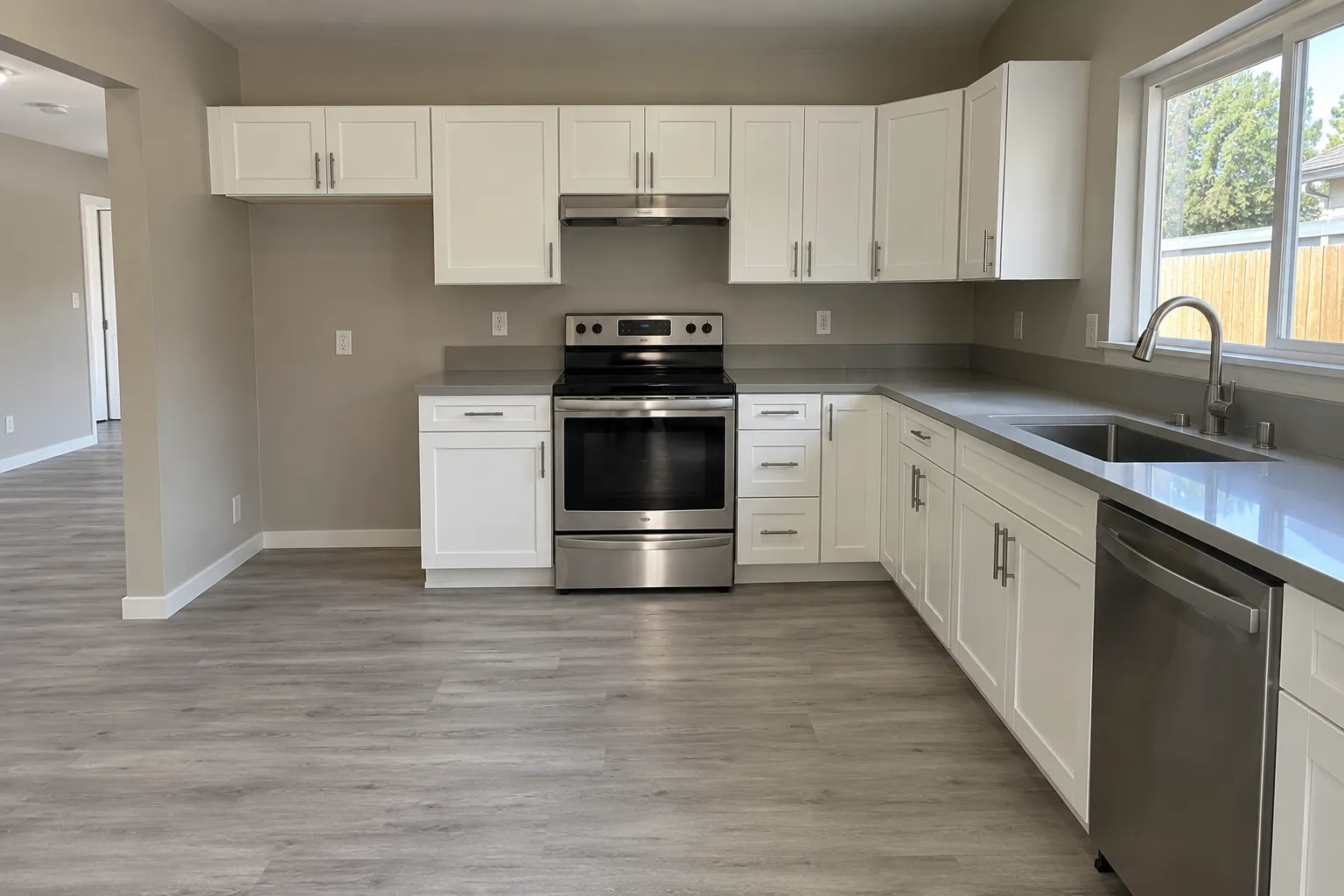 Kitchen at move-in: clean counter beside the range.